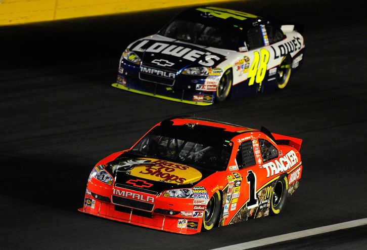 Jamie McMurray leads Jimmie Johnson during the closing stages of the Bank of America 500 at Charlotte Motor Speedway. Credit: John Harrelson/Getty Images for NASCAR